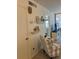 Living room with a chair and built-in shelves at 232 Saint Augustine Ave # 404, Venice, FL 34285