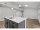 Modern kitchen island with white quartz countertop and gray cabinets at 2580 Sheila Ln, North Port, FL 34286