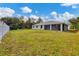 Large backyard with a view of the house at 3328 Waterloo Ter, North Port, FL 34286