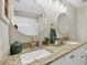 Bathroom with double vanity, granite countertop, and updated fixtures at 3328 Waterloo Ter, North Port, FL 34286