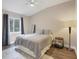 Cozy bedroom with a queen bed and wood-look floors at 3328 Waterloo Ter, North Port, FL 34286