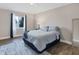 Guest bedroom with a full-size bed, and wood-look flooring at 3328 Waterloo Ter, North Port, FL 34286