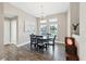 Dining room with round table and chairs, hardwood floors at 3328 Waterloo Ter, North Port, FL 34286