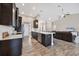 Modern kitchen with dark cabinets and white countertops at 3328 Waterloo Ter, North Port, FL 34286