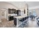 Modern kitchen with dark cabinetry and a large island at 3328 Waterloo Ter, North Port, FL 34286