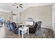 Living room with leather reclining sofas and hardwood floors at 3328 Waterloo Ter, North Port, FL 34286