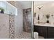 Large walk-in shower with pebble floor and modern tile at 3328 Waterloo Ter, North Port, FL 34286