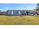 Large backyard with a fenced area and lawn at 370 Waltham St, Port Charlotte, FL 33952