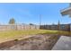 Large grassy backyard with a wooden fence at 370 Waltham St, Port Charlotte, FL 33952