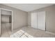 Bright bedroom with tile floors and a double door closet at 370 Waltham St, Port Charlotte, FL 33952