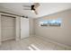 Bedroom featuring a barn door to the closet and tile floors at 370 Waltham St, Port Charlotte, FL 33952