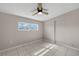 Bedroom with ceiling fan, tile floors, and large window at 370 Waltham St, Port Charlotte, FL 33952