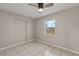 Spacious bedroom with ceiling fan and tiled floors at 370 Waltham St, Port Charlotte, FL 33952