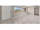 Living room with tile floors and large windows at 370 Waltham St, Port Charlotte, FL 33952