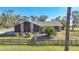 House exterior view, stone and wood siding at 3740 Hidden Valley Cir, Punta Gorda, FL 33982