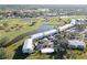 Aerial view showcasing community buildings and lush landscaping at 404 Cerromar N Cir # 116, Venice, FL 34293