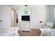 Bedroom with twin beds and wicker dresser at 404 Cerromar N Cir # 116, Venice, FL 34293