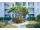 Attractive building exterior with landscaping and walkway at 404 Cerromar N Cir # 116, Venice, FL 34293