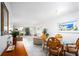 Dining area with table and chairs, open to living room at 404 Cerromar N Cir # 116, Venice, FL 34293