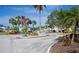 Community entrance with landscaping and an American flag at 404 Cerromar N Cir # 116, Venice, FL 34293