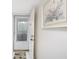 Inviting entryway with a white door and framed artwork at 404 Cerromar N Cir # 116, Venice, FL 34293