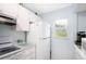 Efficient kitchen with white cabinets and window at 404 Cerromar N Cir # 116, Venice, FL 34293