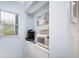 Kitchen nook with microwave, coffee maker, and storage at 404 Cerromar N Cir # 116, Venice, FL 34293