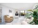 Bright living room with comfy furniture and view to patio at 404 Cerromar N Cir # 116, Venice, FL 34293