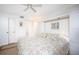 Main bedroom with a king-size bed and built-in shelving at 404 Cerromar N Cir # 116, Venice, FL 34293