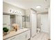 Bathroom with light vanity, large mirror, and shower/tub combo at 4110 Central Sarasota Pkwy # 127, Sarasota, FL 34238