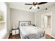 Bedroom with hardwood floors, large window, and modern bed at 4110 Central Sarasota Pkwy # 127, Sarasota, FL 34238