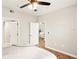 Bright bedroom with hardwood floors and view of living room at 4110 Central Sarasota Pkwy # 127, Sarasota, FL 34238