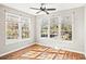 Spacious bedroom with hardwood floors and large windows providing abundant natural light at 4110 Central Sarasota Pkwy # 127, Sarasota, FL 34238
