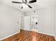 Bright bedroom with wood floors and access to a modern bathroom at 4110 Central Sarasota Pkwy # 127, Sarasota, FL 34238