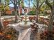 Relaxing community courtyard with fountain and benches, surrounded by lush landscaping at 4110 Central Sarasota Pkwy # 127, Sarasota, FL 34238