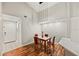 Bright dining area with kitchen views and hardwood floors at 4110 Central Sarasota Pkwy # 127, Sarasota, FL 34238