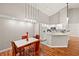 Dining area with four chairs and a kitchen view at 4110 Central Sarasota Pkwy # 127, Sarasota, FL 34238