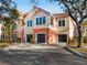 Two-story townhome with two-car garage and mature landscaping at 4110 Central Sarasota Pkwy # 127, Sarasota, FL 34238