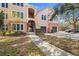 Building exterior showcasing walkway to entrance and garages at 4110 Central Sarasota Pkwy # 127, Sarasota, FL 34238