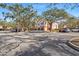 Building exterior with covered parking and landscaping at 4110 Central Sarasota Pkwy # 127, Sarasota, FL 34238