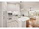 Modern kitchen featuring white cabinets, quartz countertops, and stainless steel appliances at 4110 Central Sarasota Pkwy # 127, Sarasota, FL 34238