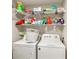 Laundry area with washer, dryer, and shelving at 4110 Central Sarasota Pkwy # 127, Sarasota, FL 34238
