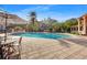 Resort-style pool with patio furniture and lush landscaping at 4110 Central Sarasota Pkwy # 127, Sarasota, FL 34238