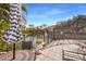 Peaceful waterfront patio with seating and lake view at 4110 Central Sarasota Pkwy # 127, Sarasota, FL 34238
