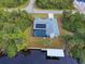 Aerial view of canal-front home with private pool and dock at 419 Ramblewood St, Port Charlotte, FL 33953