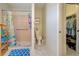 Bathroom with walk-in shower, toilet, and adjacent closet at 419 Ramblewood St, Port Charlotte, FL 33953