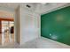 Bedroom with green accent wall and built-in closet at 419 Ramblewood St, Port Charlotte, FL 33953