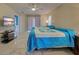 Bright bedroom with two twin beds, ceiling fan, and tiled floors at 419 Ramblewood St, Port Charlotte, FL 33953