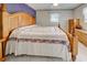 Main bedroom with king-size bed, dresser, and wood furniture at 419 Ramblewood St, Port Charlotte, FL 33953