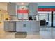 Modern kitchen with gray cabinets, stainless steel appliances, and an island at 419 Ramblewood St, Port Charlotte, FL 33953